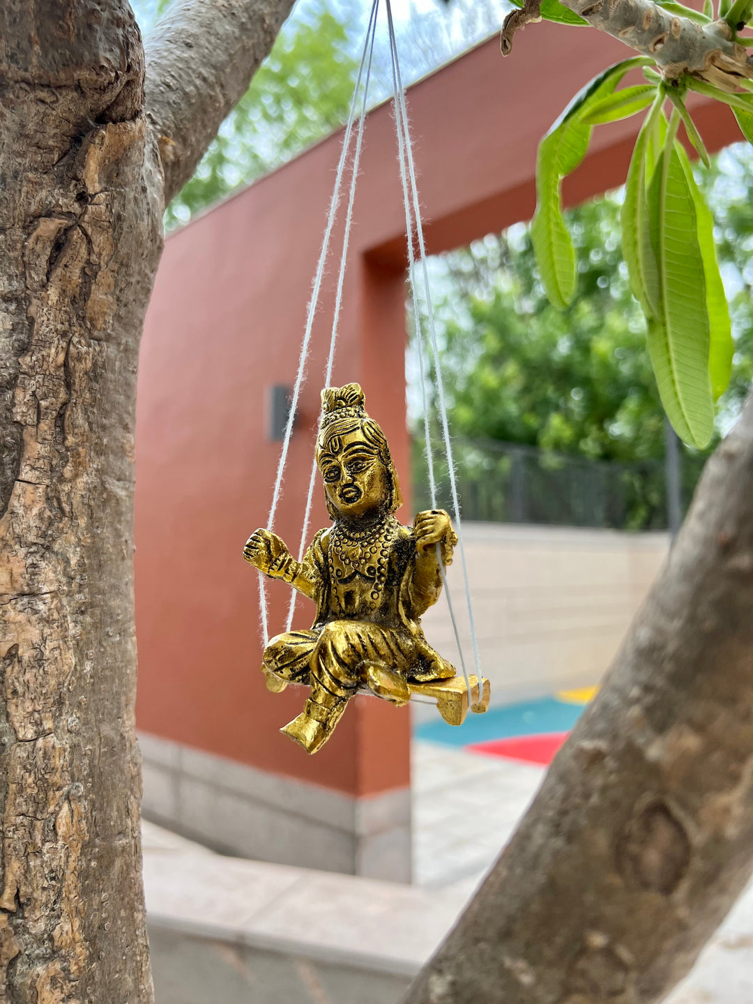 Gold Plated Krishna Idol with attached Jhula